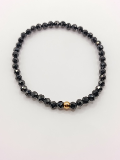 Bransoletka z czarnego turmalinu i jednej złotej kuleczki