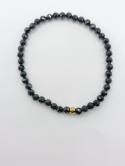 Bransoletka z czarnego turmalinu i jednej złotej kuleczki